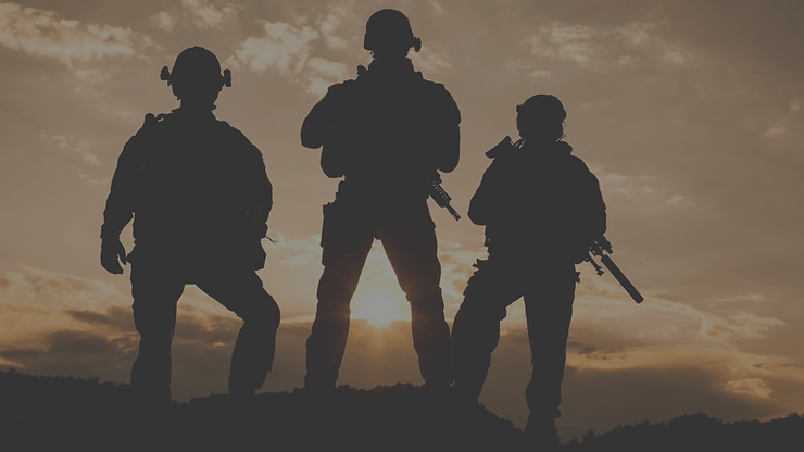 three silhouetted soldiers