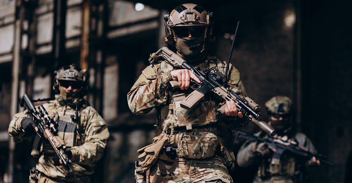 soldiers standing with guns and in camouflage